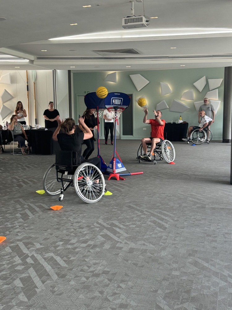 Players in the sports wheelchairs a team built for them