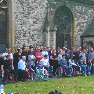 Group of people at wheelchair challenge event Performance Wheelchair Challenge Team Build