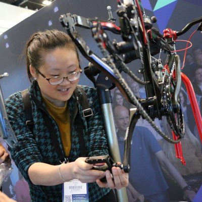 Charity Bike Build Woman fixing bike pedal