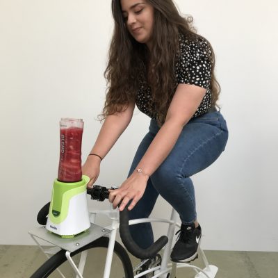 Lady making a smoothie Pedalling Smoothie Team Building Charity Challenge