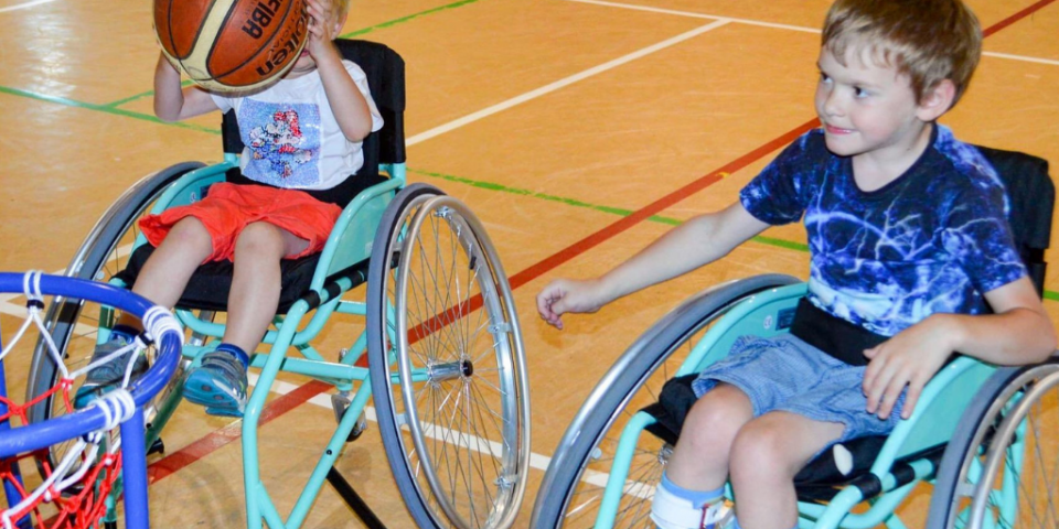 Two lads playing wheelchair basketball