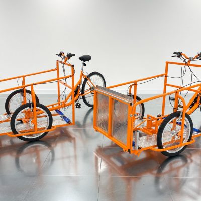 2 orange Wheelchair Cargo Bikes Wheelchair Charity Cargo Bikes